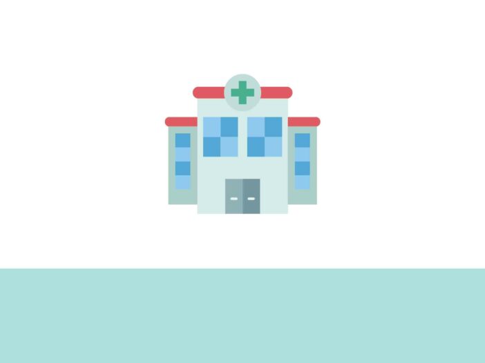 imagen de un edificio de hospital con una cruz de sanidad
